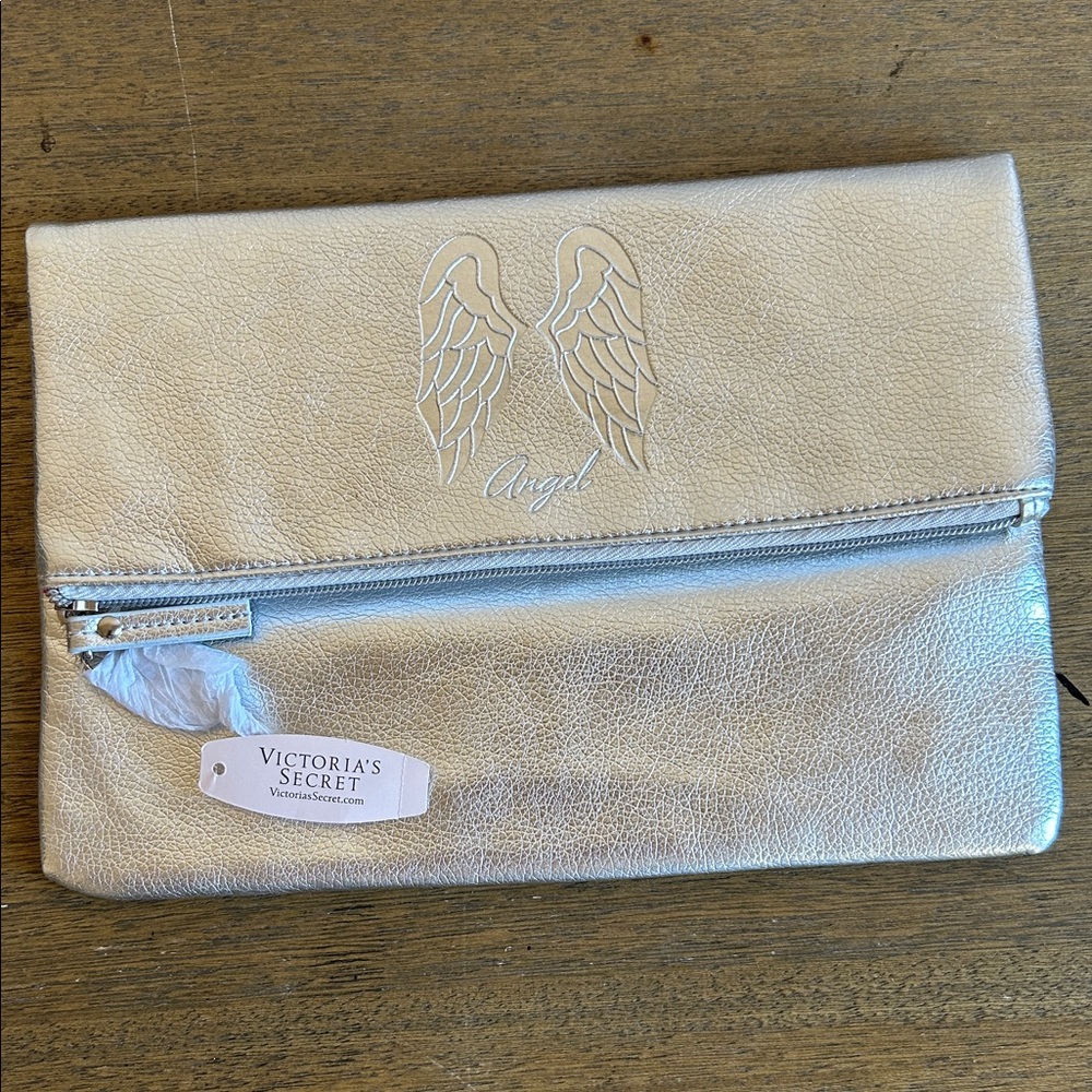 Victoria's Secret Metallic Silver Foldover Clutch
W/ An Embossed Angel Wing Logo
